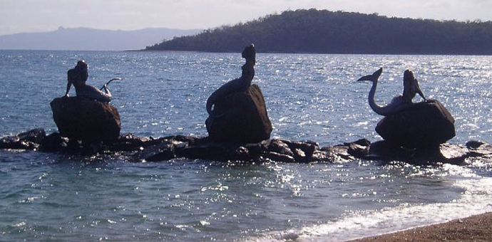 reclining mermaids