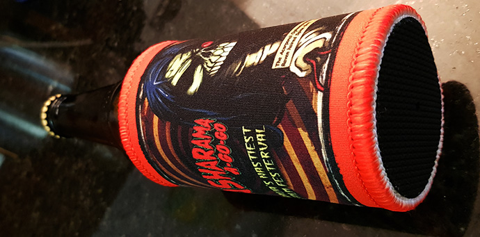 Spine Grrl Stubbie Cooler with Maelstrom background